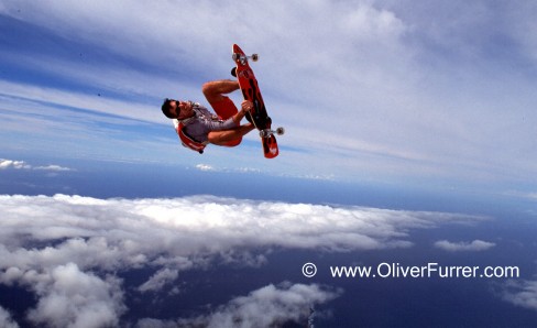 skateboard skydive jump over Hawaii
