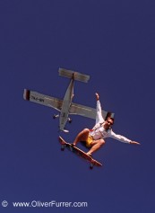 skateboard skydive jump in the blue sky